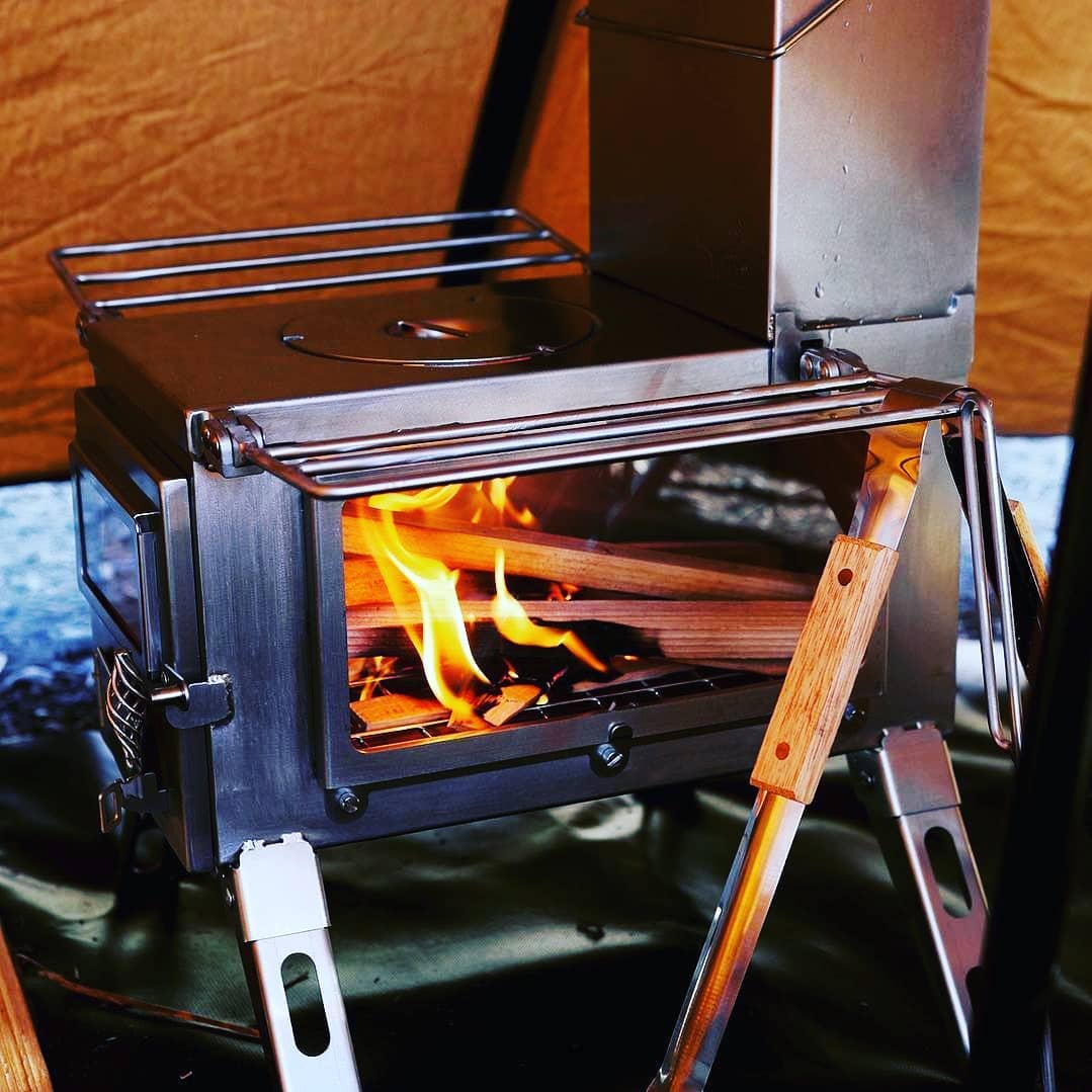 Stainless steel wood stove Winnerwell Nomad View used as portable wood stove and hot tent stove for efficient heating and camp cooking outdoors