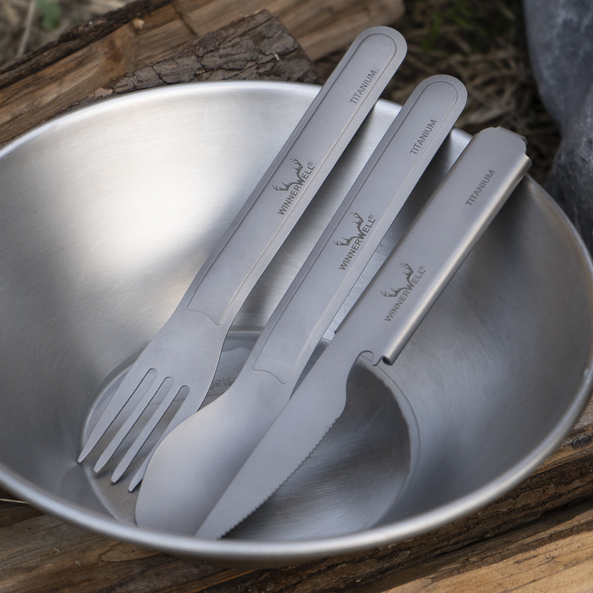 Winnerwell® titanium cutlery set neatly stored inside a metal bowl, ideal for organized packing during outdoor trips.