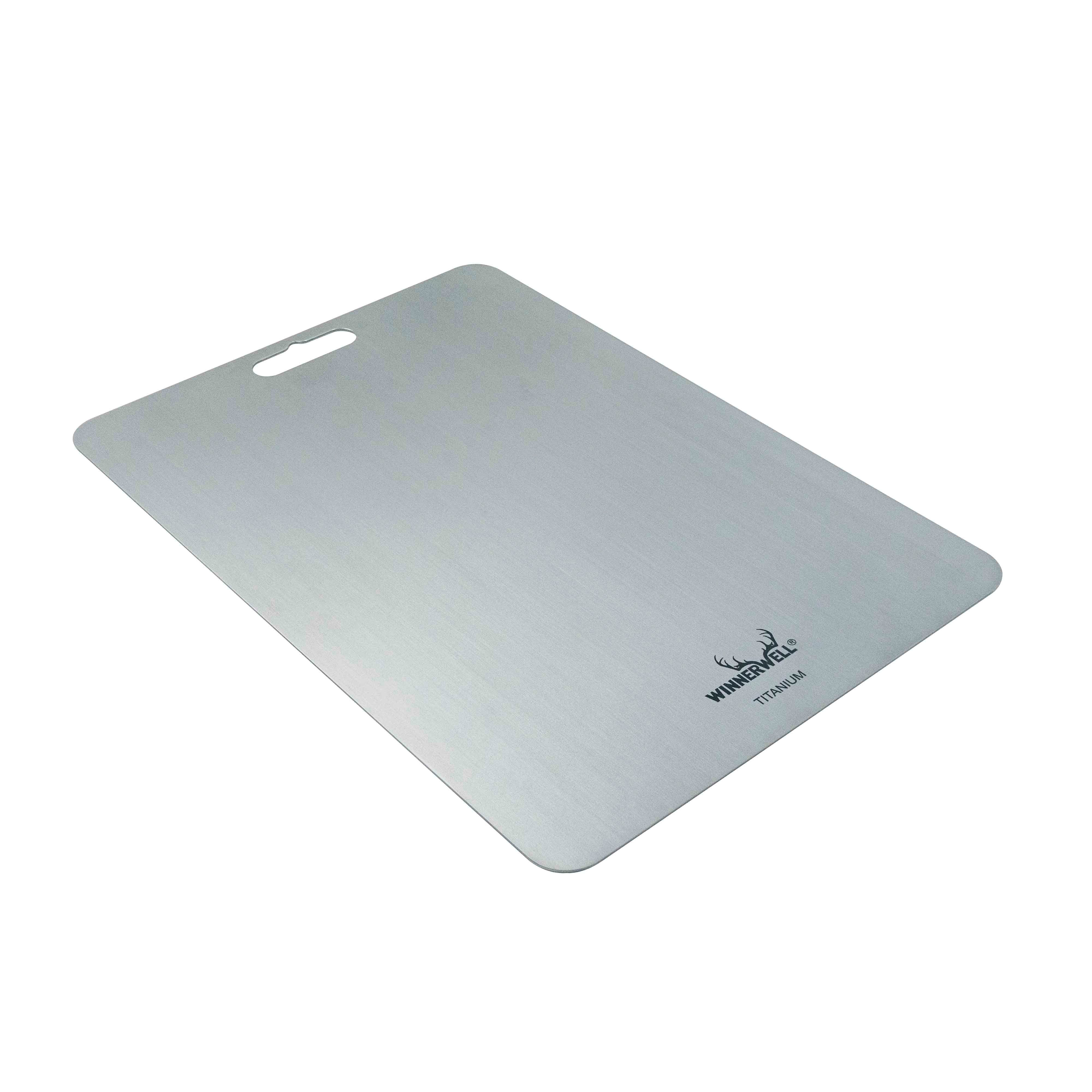 Side view of Winnerwell® titanium cutting board on a white background, highlighting its thin, lightweight, and portable design.