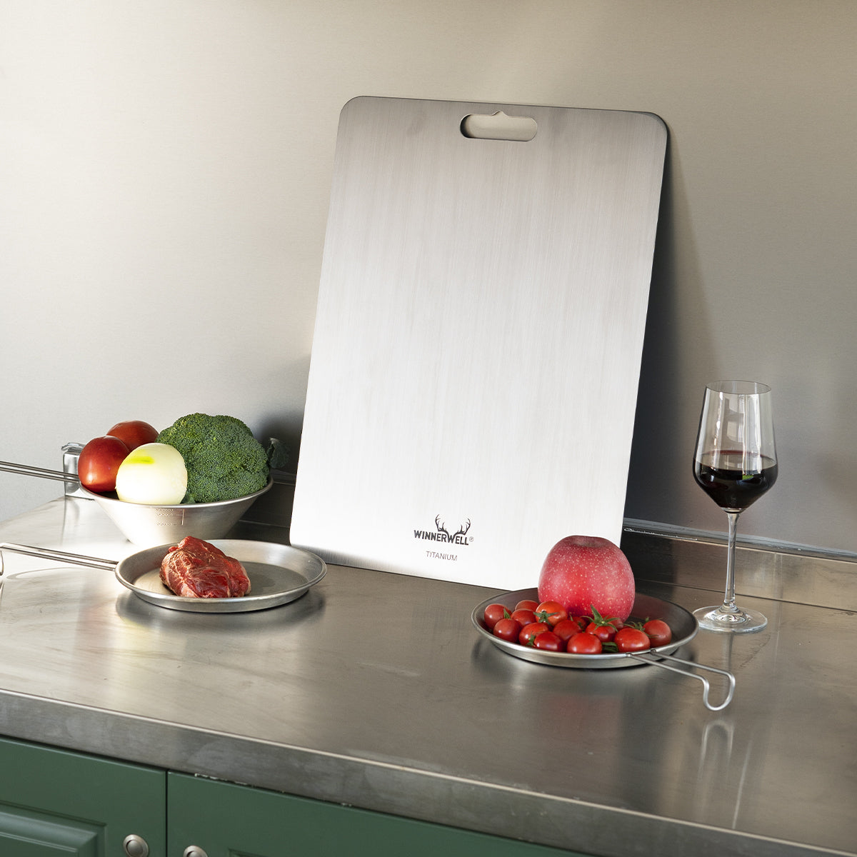 Winnerwell® titanium cutting board used in a kitchen environment, showing its practical application for food preparation at home.