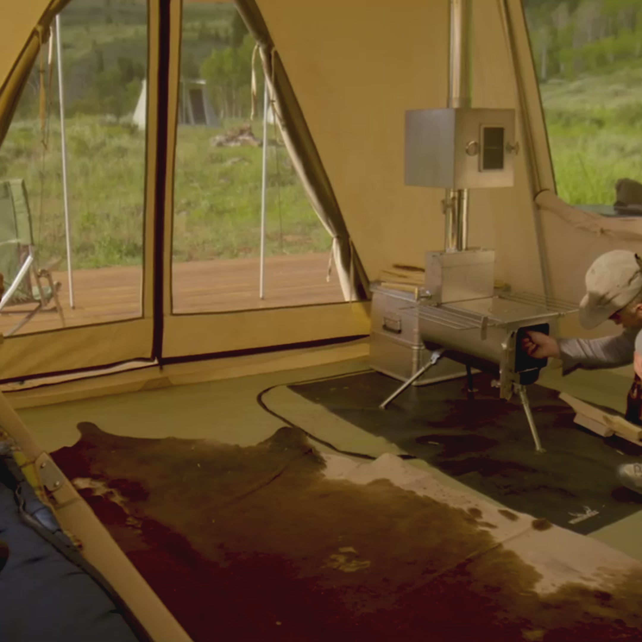 Video showcasing Winnerwell® Woodlander 1G Stove inside a tent. Features 304 stainless - steel build during assembly, foldable structure for easy storage/transport, real - time cooking of camp meals, simple ignition, damper adjustment for airflow, and brand - ensured quality. Perfect for durable, portable outdoor cooking needs.
