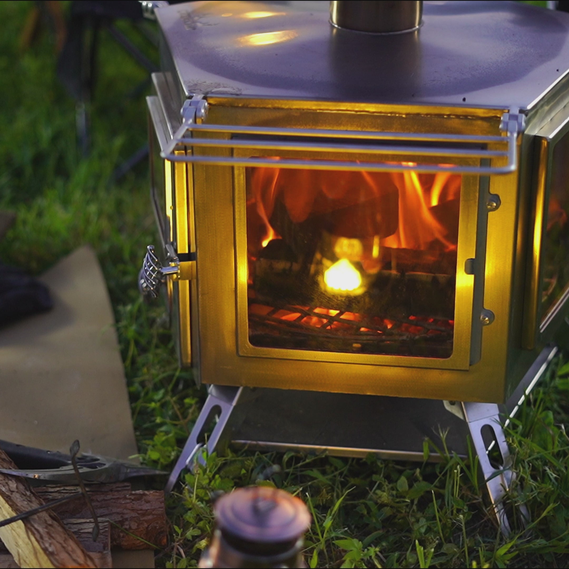 Video of Winnerwell® Pentagon Stove: Showcases 5 - sided fire - viewing design with wood burning—flames visible from multiple angles. Perfect for outdoor camping, creating a warm, immersive fire - viewing experience while heating tents or cooking. Built with durable stainless steel for rugged, off - grid use.