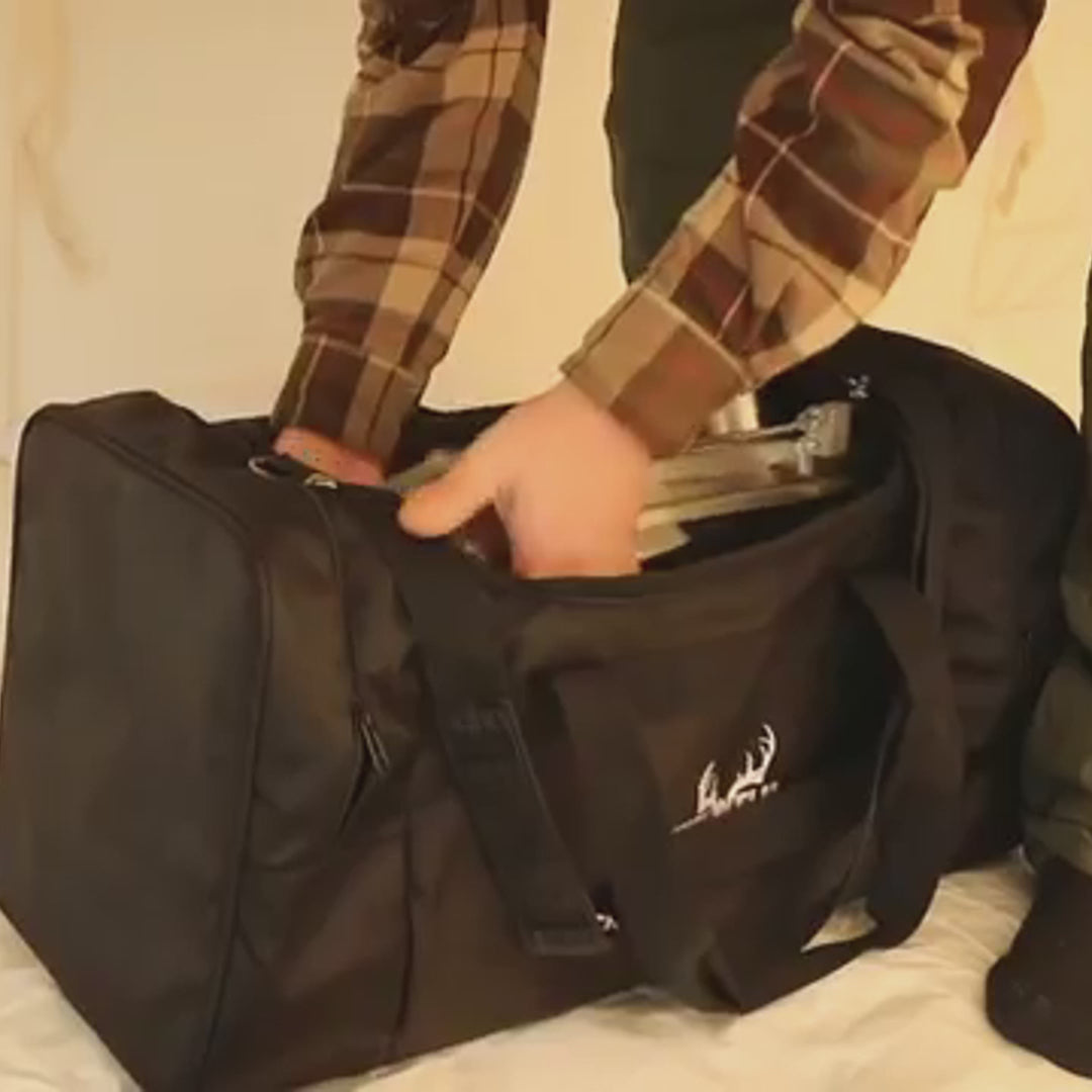 Video of Winnerwell® Woodlander Double View 1G Cook Camping Stove. Shows unfolding the stove, taking out firebox accessories for assembly, then using it inside a tent. Features beautiful burning flames visible through double - view windows, with distant scenic views in the background, highlighting its portability, ease of assembly, and role in creating a cozy camping cooking experience.