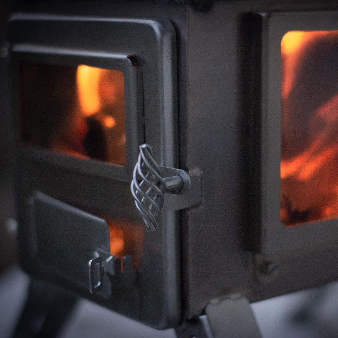 Winnerwell Nomad View portable wood stove and camping stove for outdoor cooking and heating in a hot tent stove setup with stainless steel wood stove body