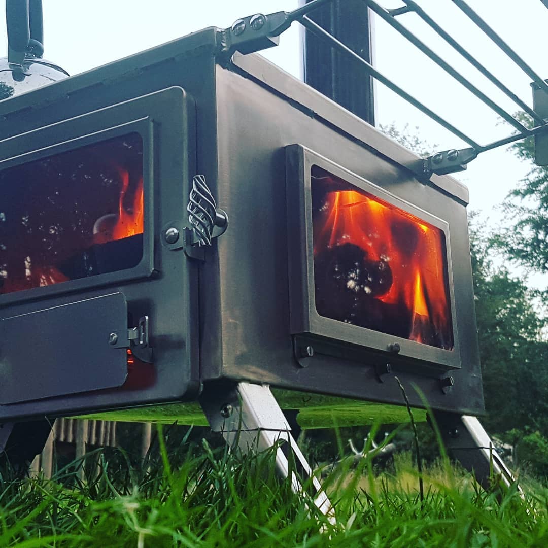 Portable wood stove Winnerwell Nomad View camping stove for reliable heat source and cooking performance in hot tent stove outdoor environments