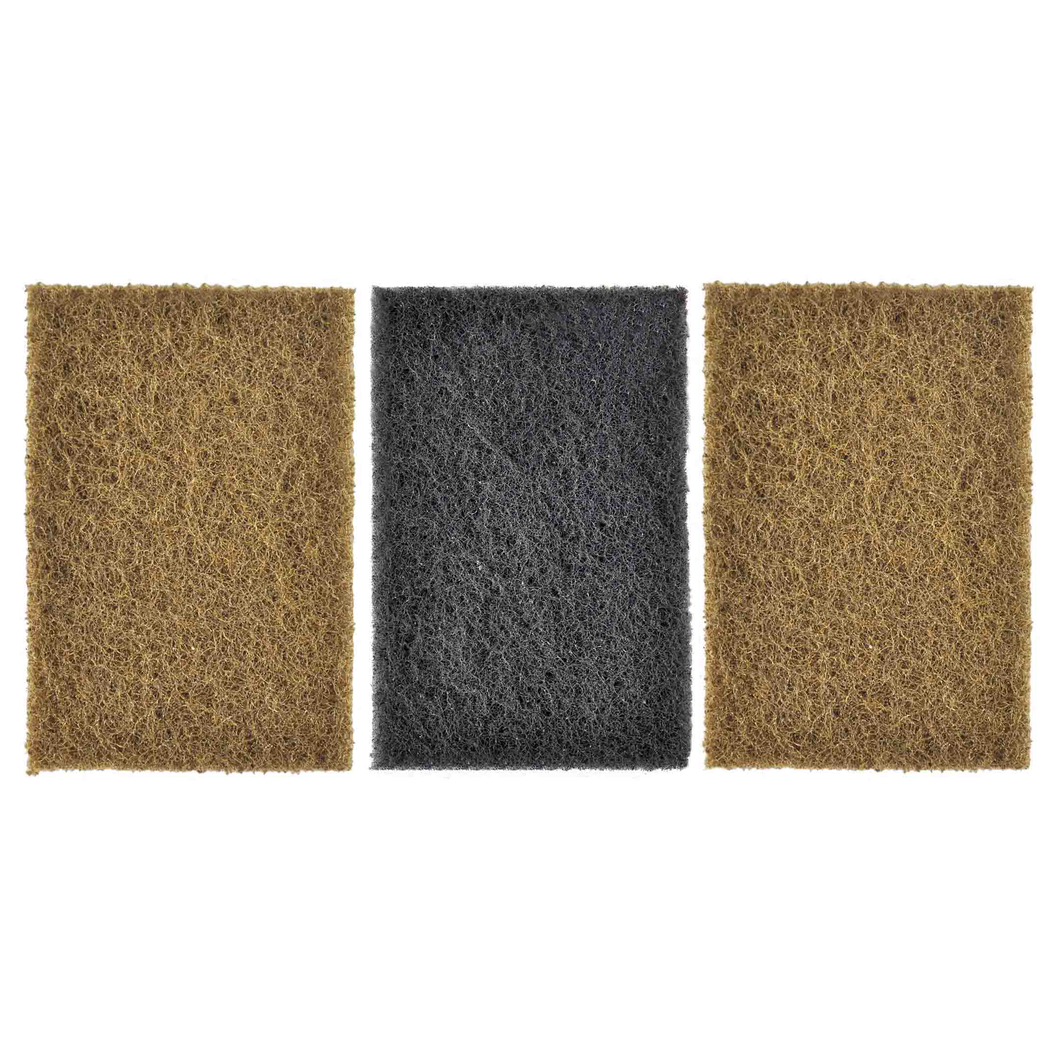 Three Winnerwell® scrubbing sponges of different colors or textures, arranged side by side, showing the variety available in the set.