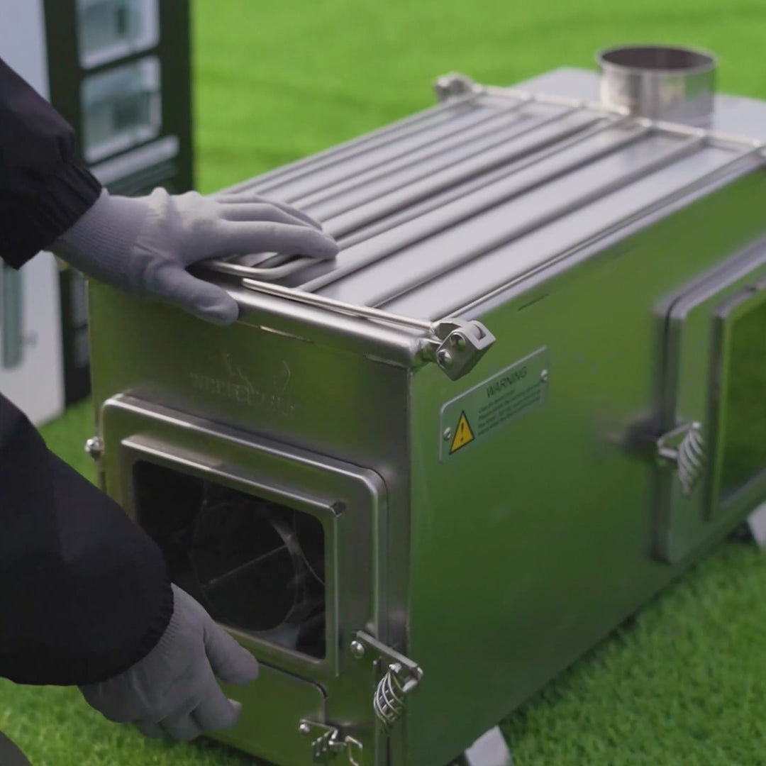 Video of Winnerwell® Ovenstove Camping Stove: Shows foldable legs, storing all accessories inside the firebox, ignition process, and baking bread. Highlights its portable design, multi - function cooking (oven + stove), and ease of use for outdoor baking adventures.