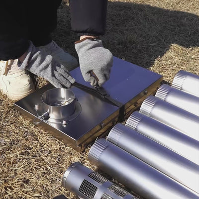 Video showcasing Winnerwell® Fastfold Titanium Camping Stove: Assembly guide with numbered chimney (easy install), dual-purpose (fire pit + cooking stove), and ground nail anchors. Watch it transform from a compact unit to a fire pit/stove, plus cooking demos—ideal for outdoor enthusiasts needing versatile, portable gear.
